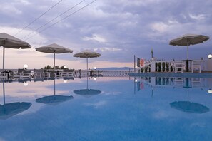 Outdoor pool, pool umbrellas, sun loungers
