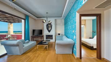 Suite Grand | Zona de estar | Una televisión de pantalla plana
