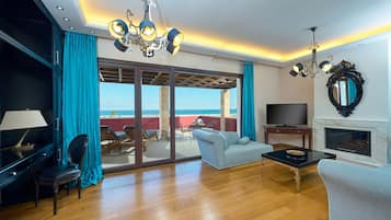 Suite Grand | Zona de estar | Una televisión de pantalla plana