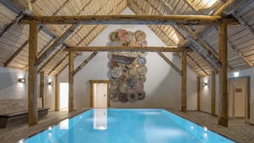 Indoor pool, open 7:00 AM to 10:00 PM, pool loungers