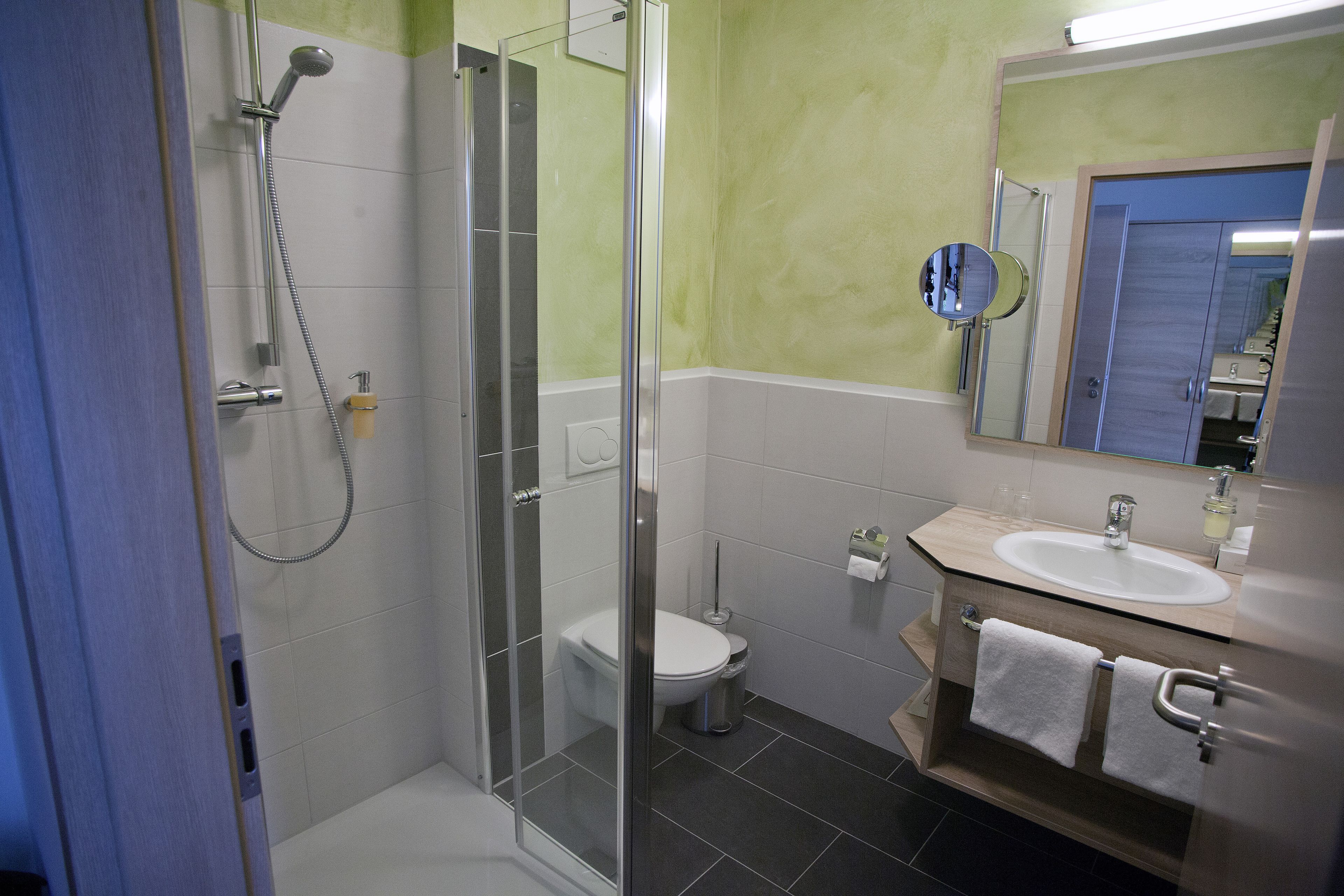 shower, free toiletries, bathrobes, slippers