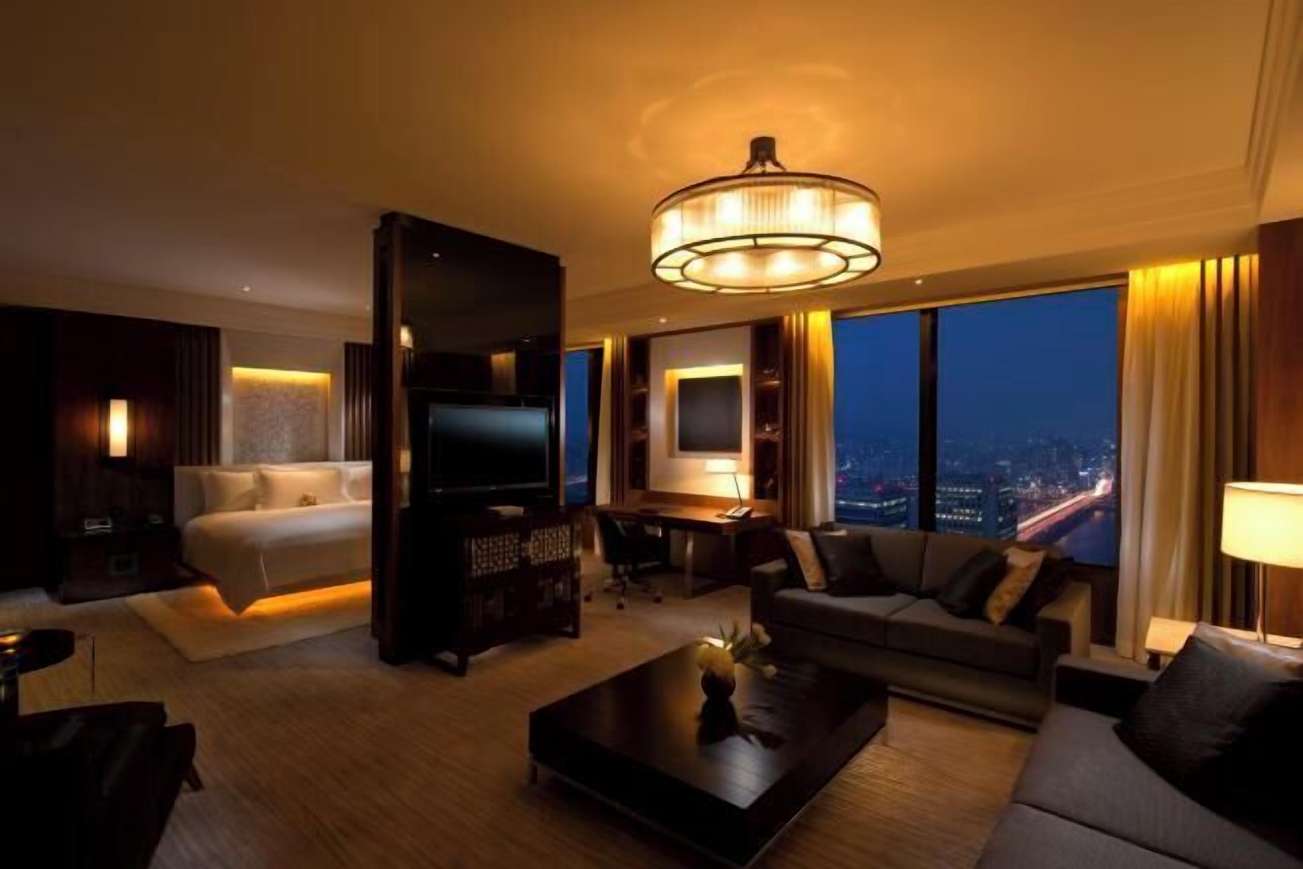 Luxe beddengoed, donsdekens, pillowtop-bedden, een minibar