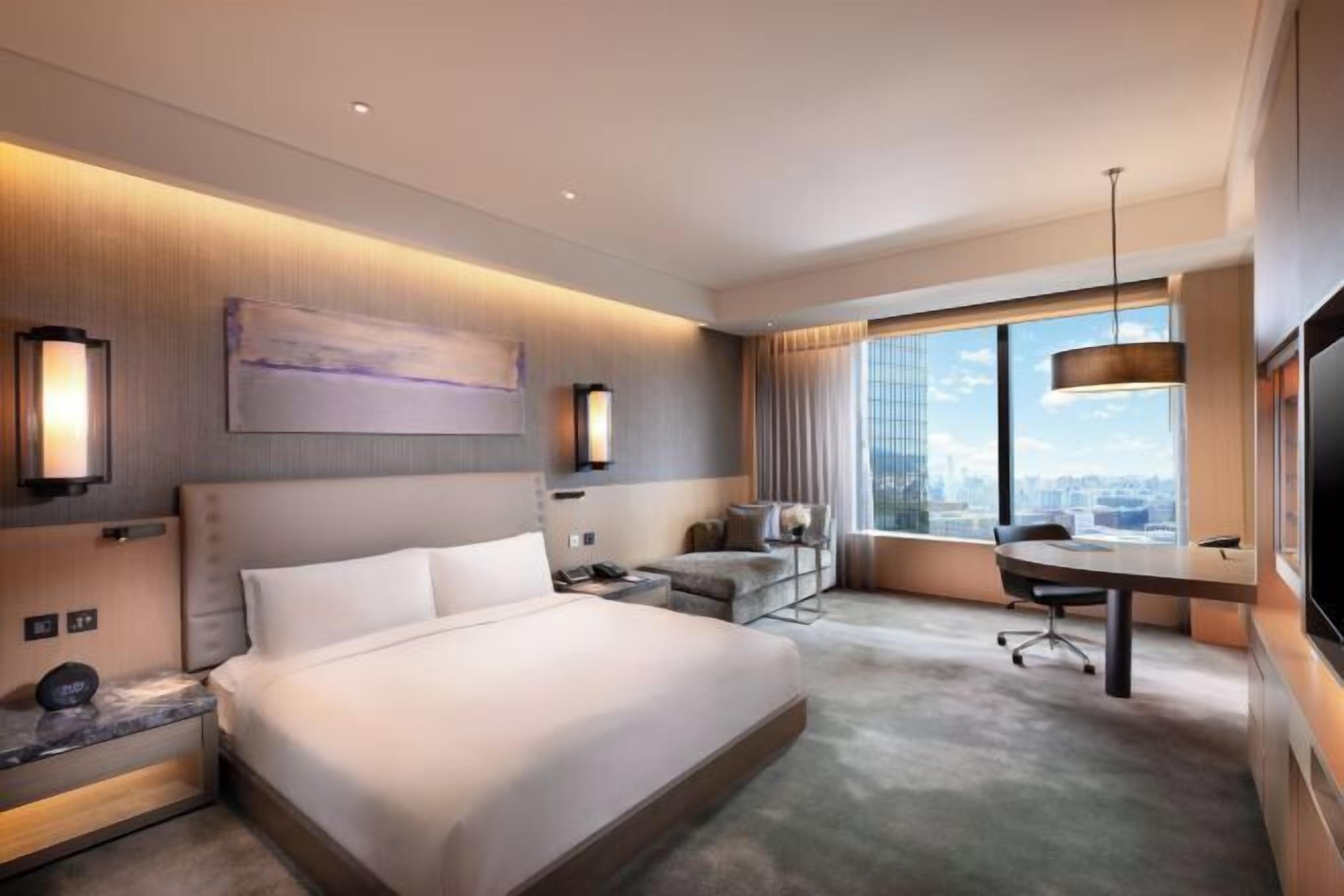 Premium bedding, down comforters, pillowtop beds, minibar