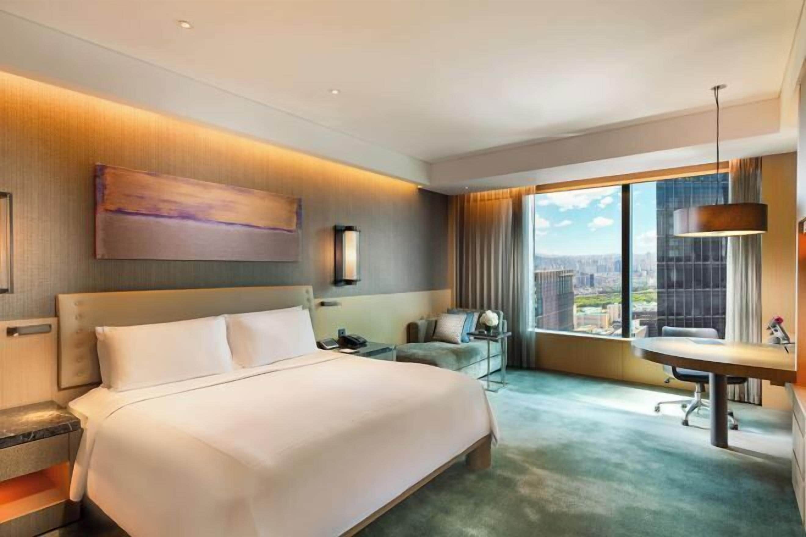 Luxe beddengoed, donsdekens, pillowtop-bedden, een minibar