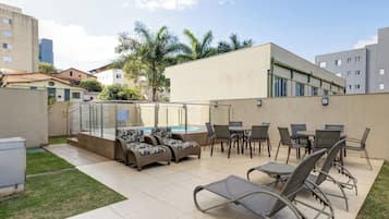 Outdoor pool, pool umbrellas, sun loungers