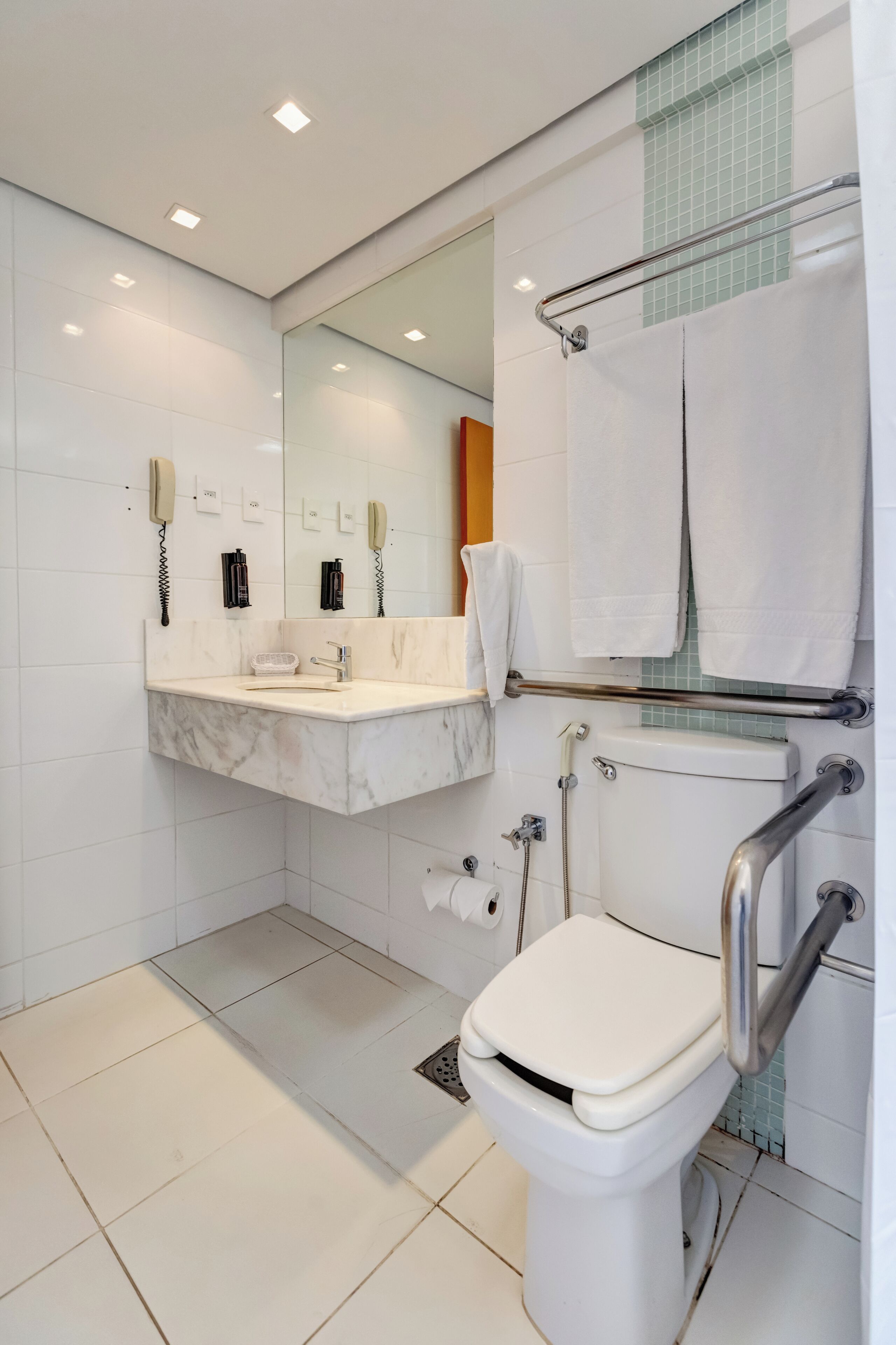 deluxe room | bathroom | shower, free toiletries, hair dryer, towels