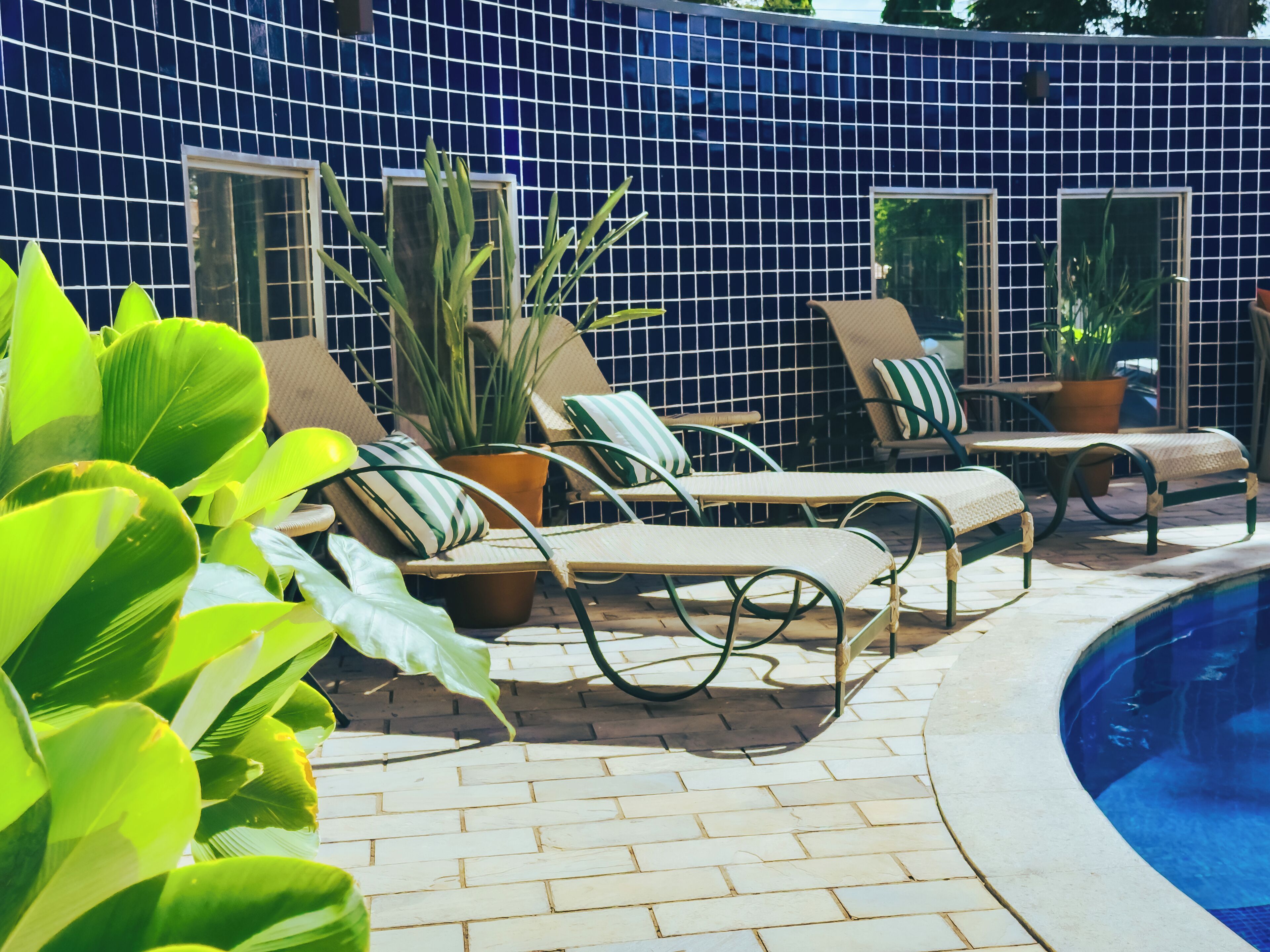 outdoor pool, open 7:00 am to 10:00 pm, pool umbrellas, pool loungers