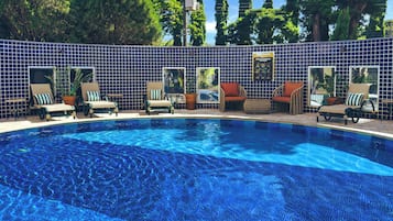 Outdoor pool, open 7:00 AM to 10:00 PM, pool umbrellas, sun loungers