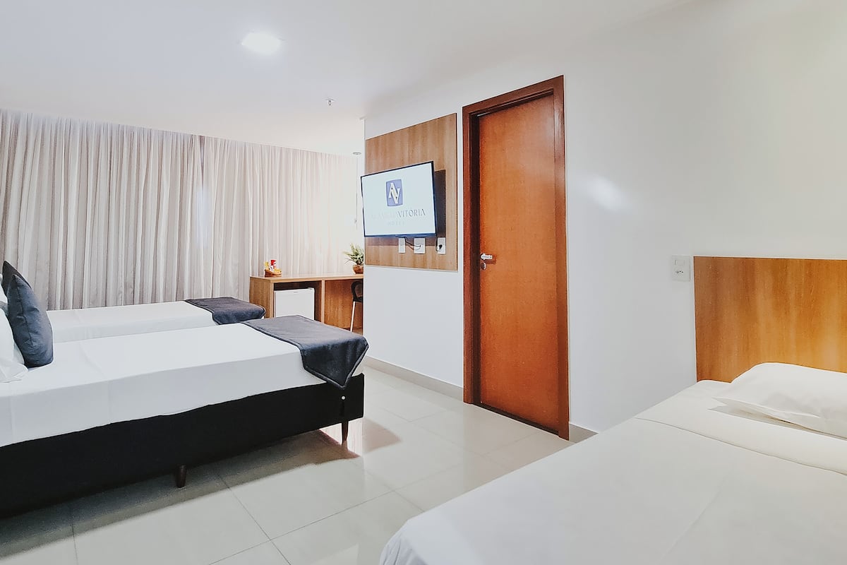 deluxe triple room | minibar, in-room safe, laptop workspace, blackout curtains