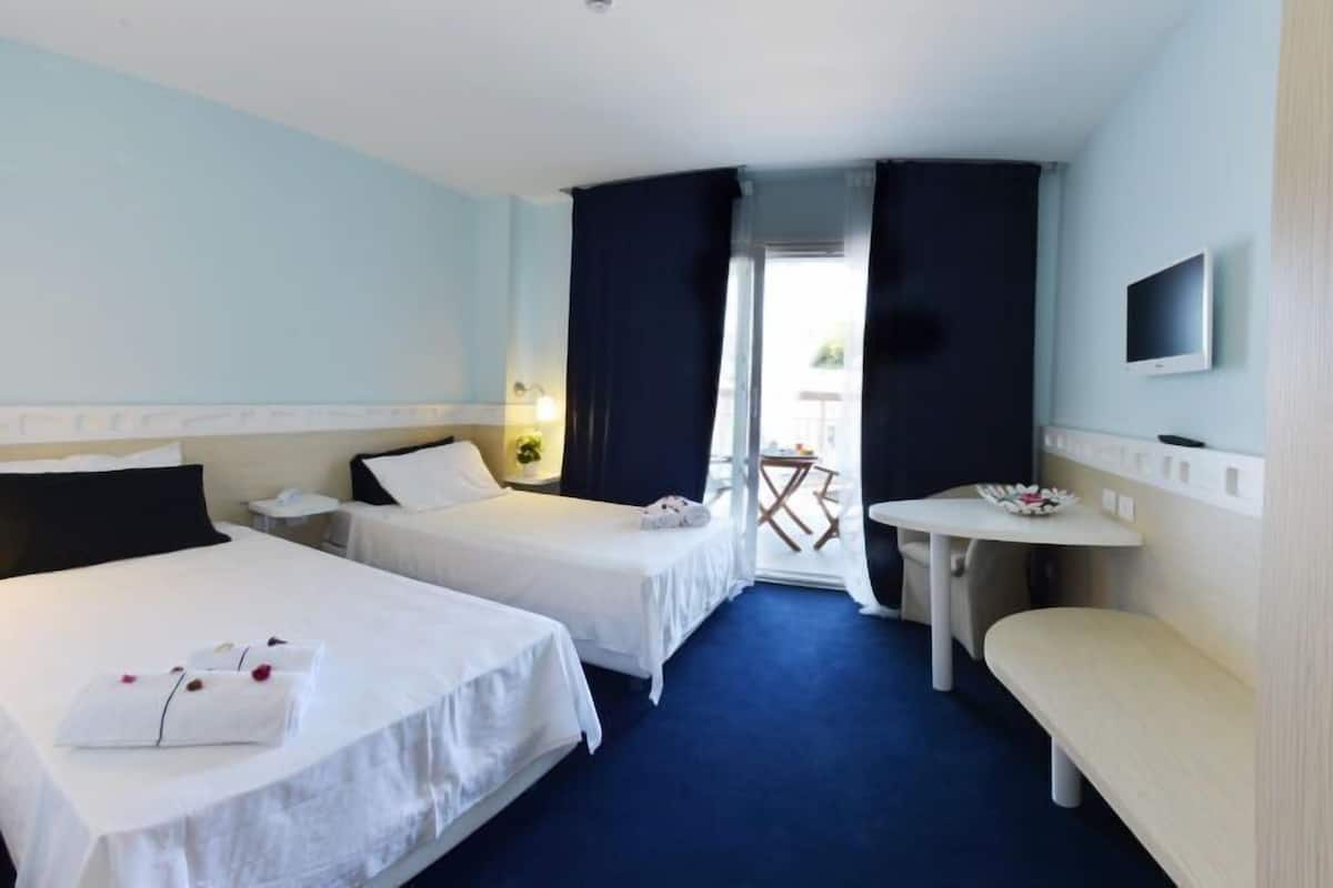 Standard Double Room Single Use | Living area | 22-inch TV with digital channels