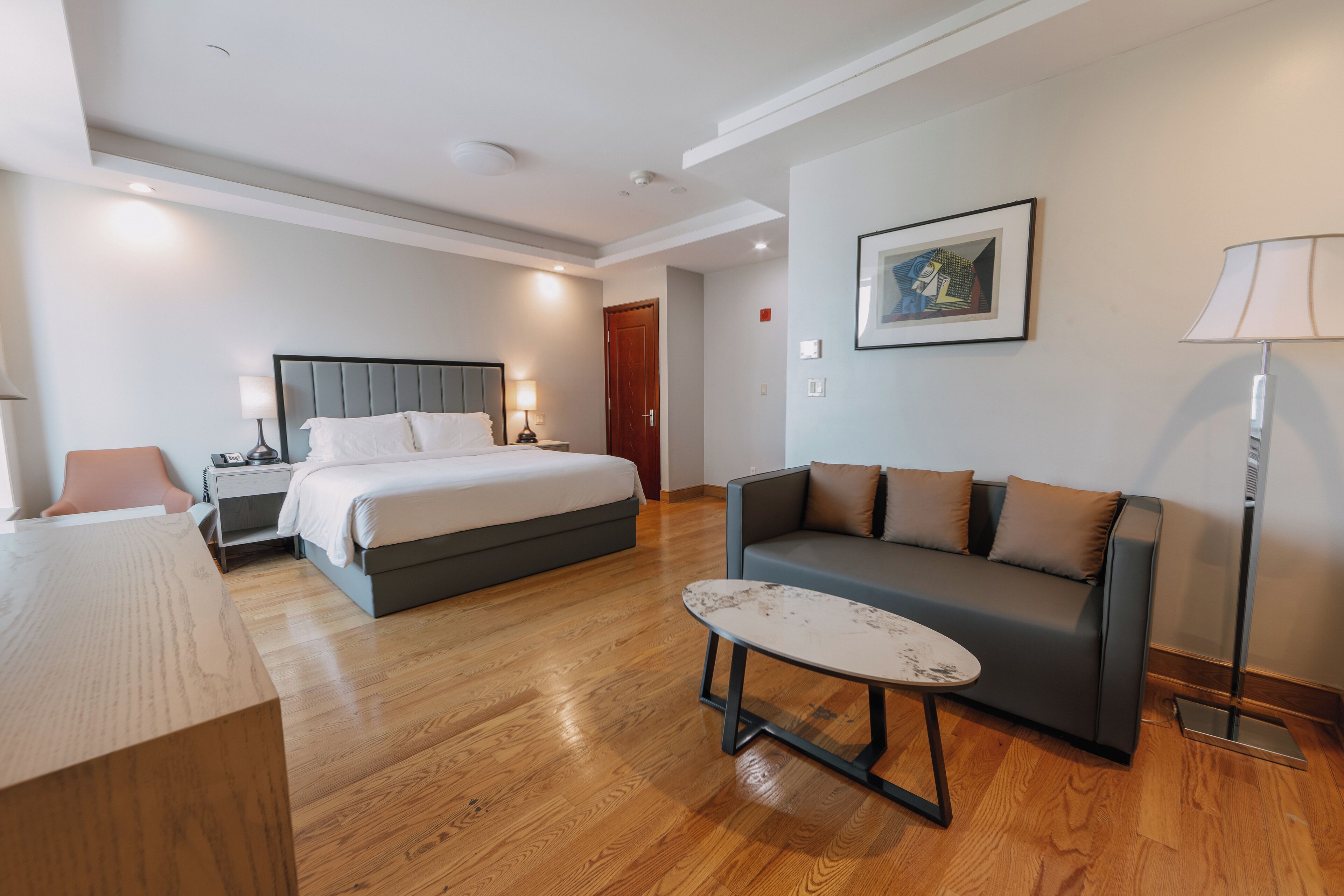 junior suite | in-room safe, desk, laptop workspace, iron/ironing board