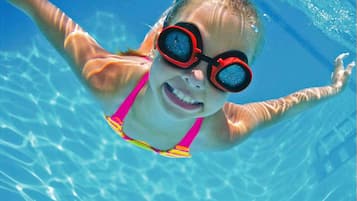 Seasonal outdoor pool, open 9:00 AM to 9:00 PM, pool loungers