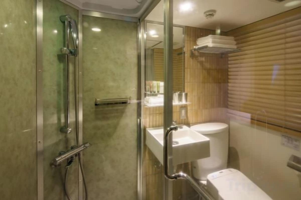 Bathroom | Shower, hair dryer, slippers, electronic bidet