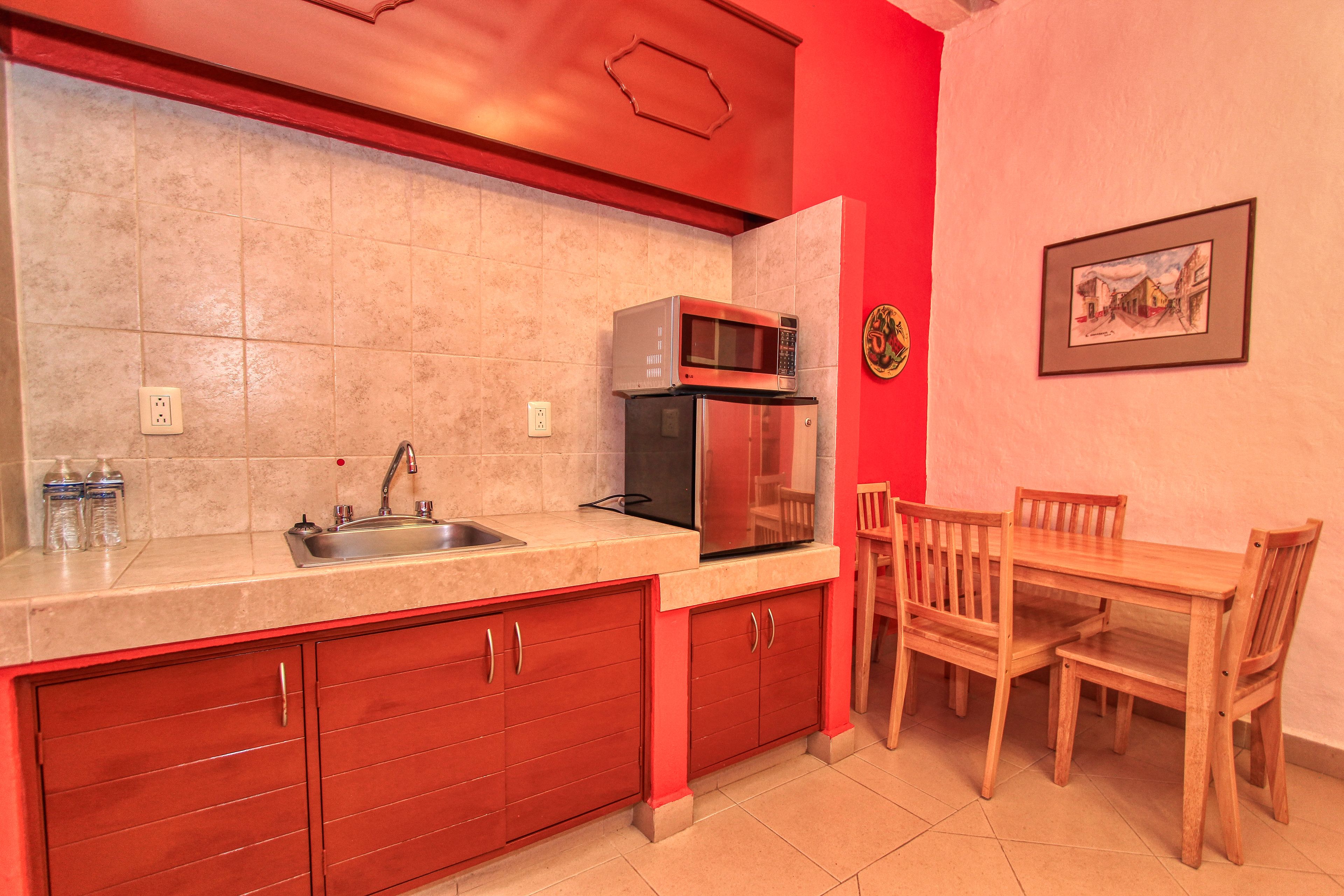 family suite, 2 double beds, refrigerator & microwave, city view | 1 bedroom, in-room safe, iron/ironing board, free wifi