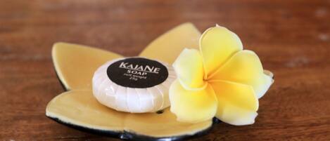 A soap bar with a label on a wooden surface.