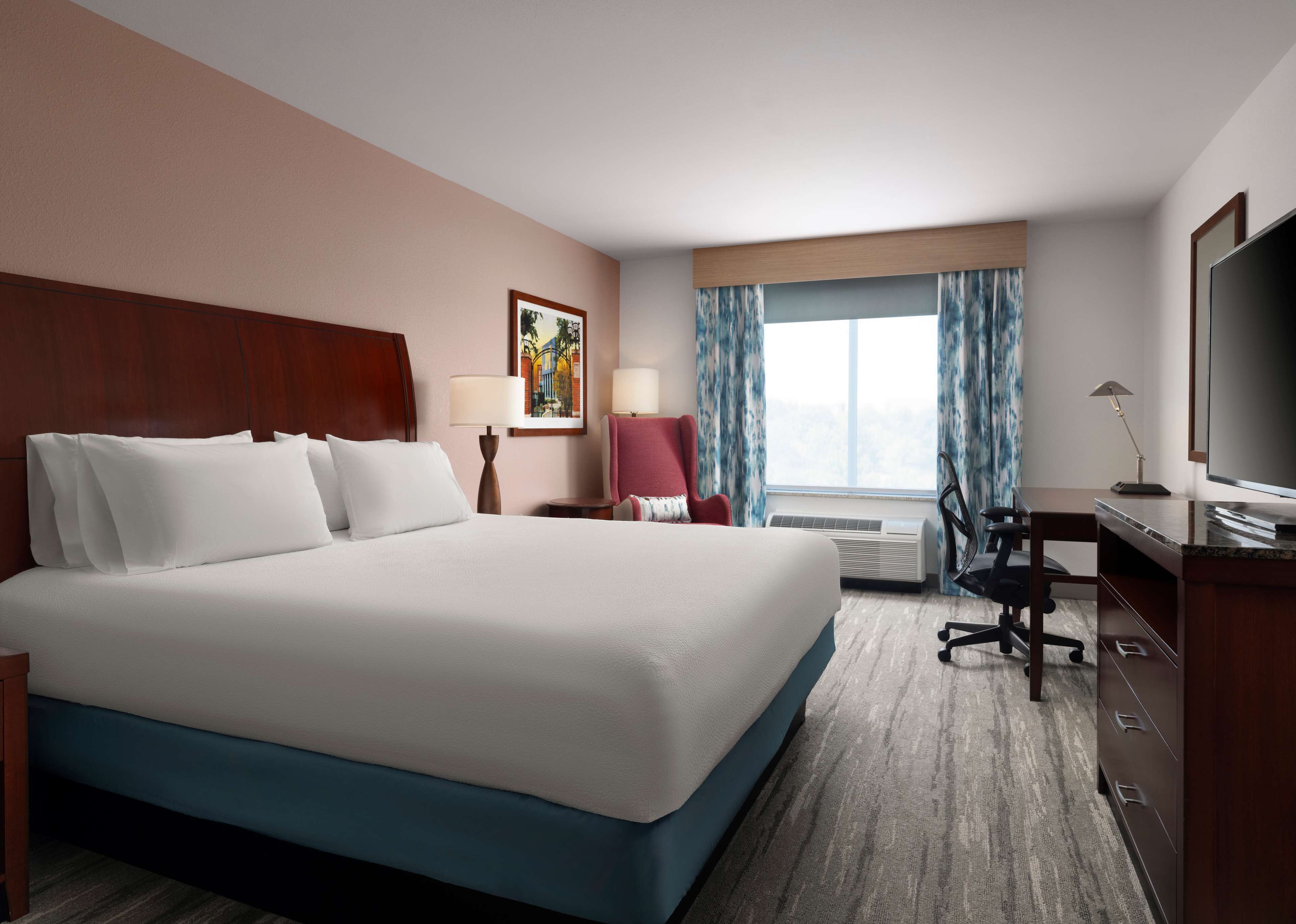 premium bedding, desk, blackout curtains, iron/ironing board