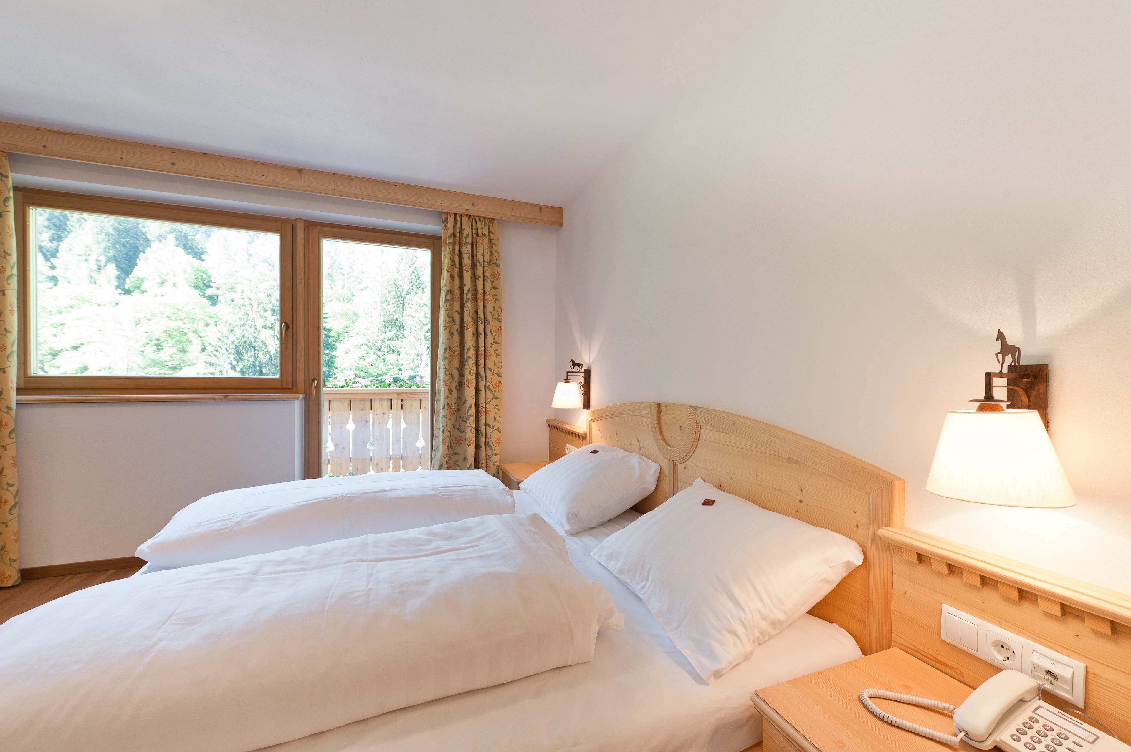 down duvets, memory-foam beds, desk, blackout curtains