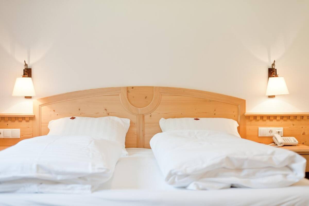 down duvets, memory-foam beds, desk, blackout curtains