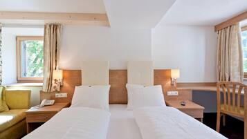 Down comforters, memory foam beds, desk, blackout drapes