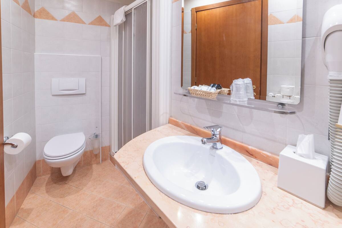 triple room | bathroom | rainfall showerhead, free toiletries, hair dryer, bidet