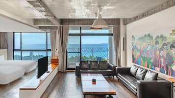 Deluxe Quad Sea View | Down comforters, desk, blackout drapes, soundproofing