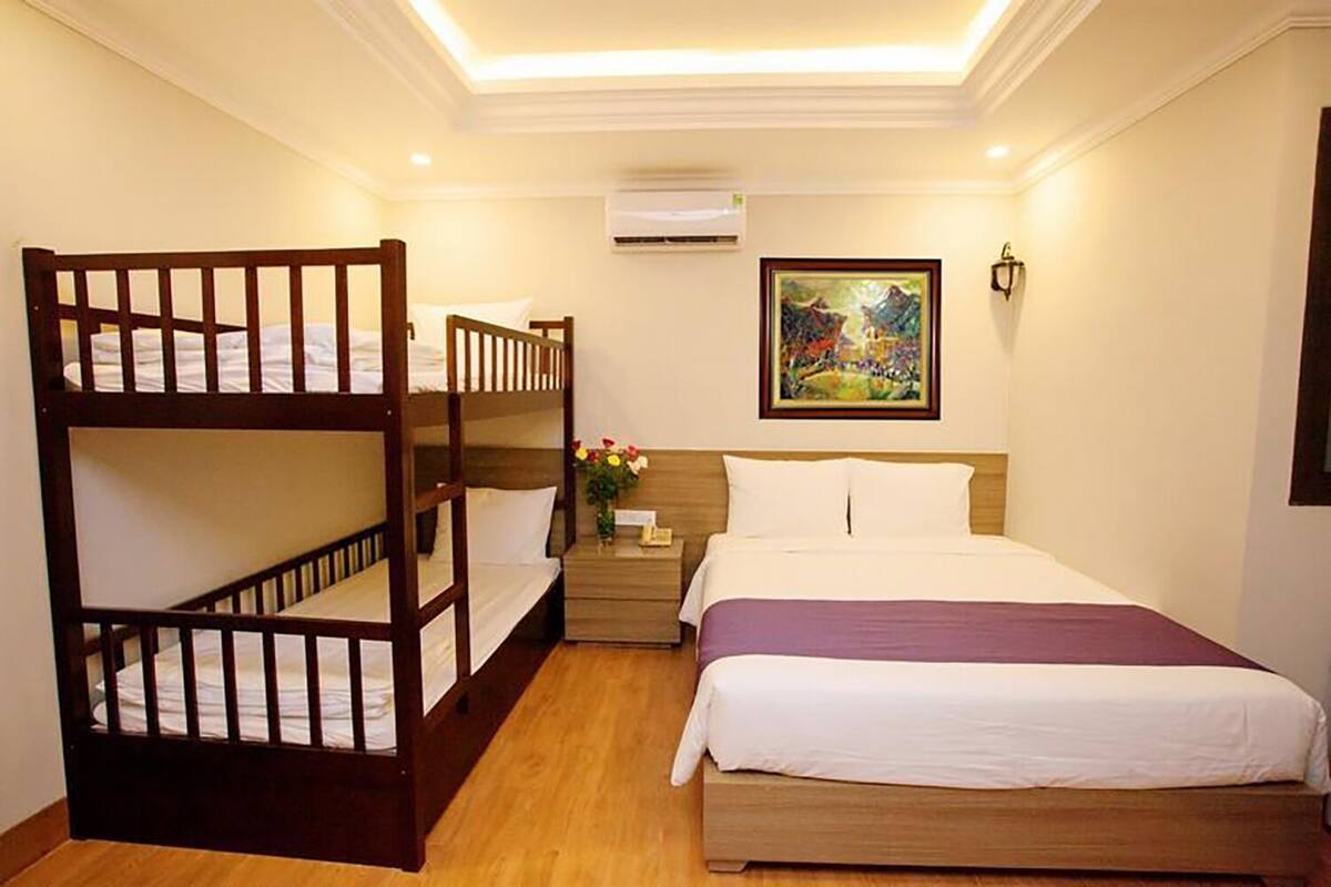 Family Quadruple Room | Minibar, in-room safe, desk, blackout curtains