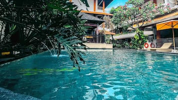 Outdoor pool, pool umbrellas, sun loungers