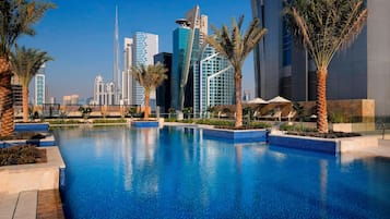Outdoor pool, open 7:00 AM to 9:00 PM, pool umbrellas, sun loungers