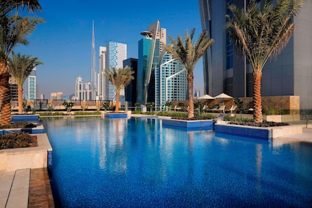 Outdoor pool, open 7:00 AM to 9:00 PM, pool umbrellas, sun loungers