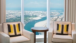 A high-rise hotel room with a view of a coastal cityscape, including a bridge and beach. - JW Marriott Marquis Hotel Dubai (Dubai)