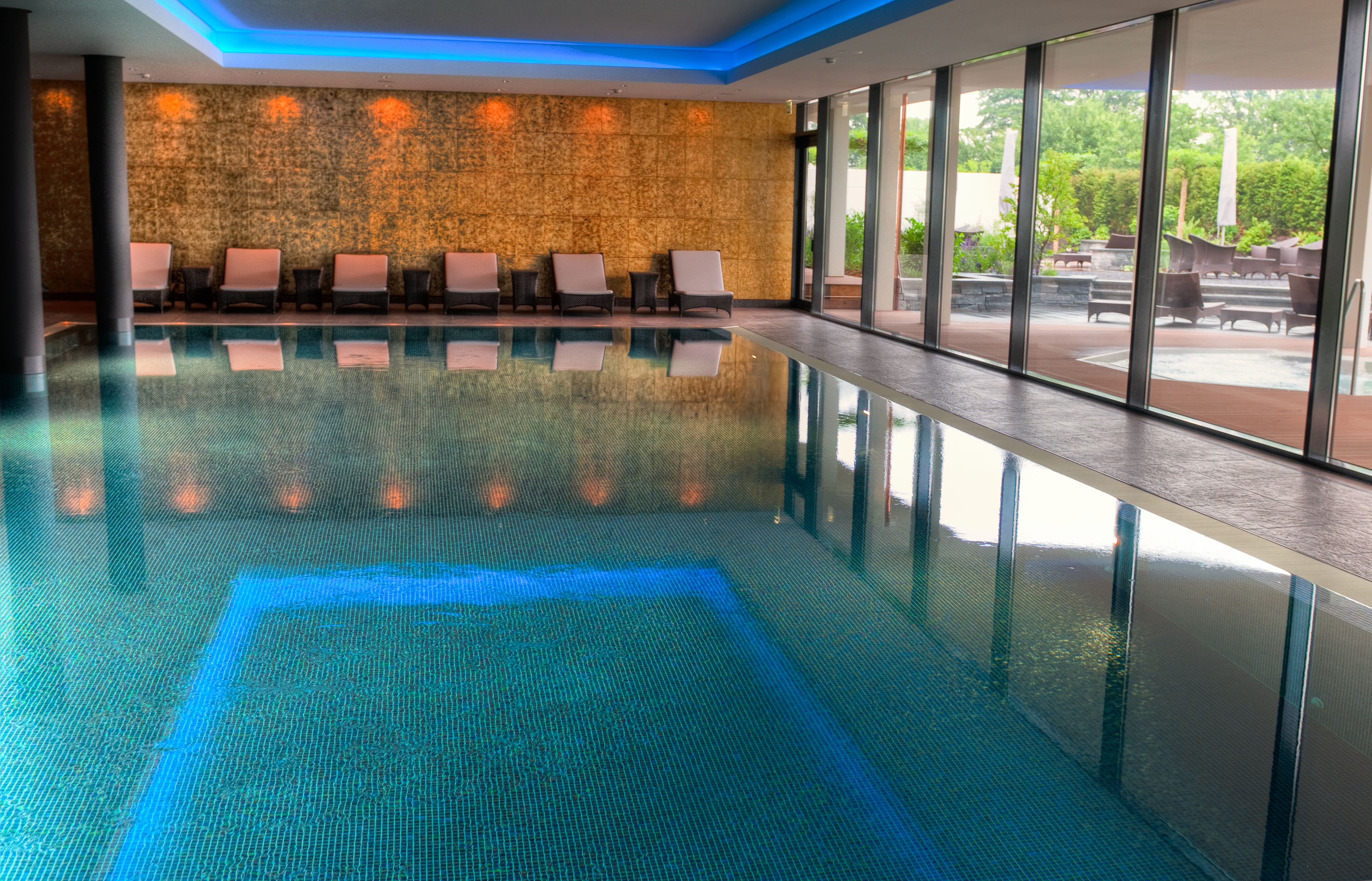 Indoor pool, open 7:00 AM to 10:00 PM, pool loungers