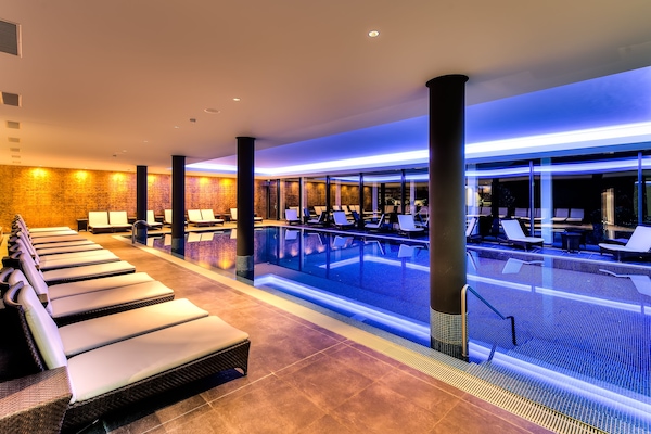 Indoor pool, open 7:00 AM to 10:00 PM, pool loungers