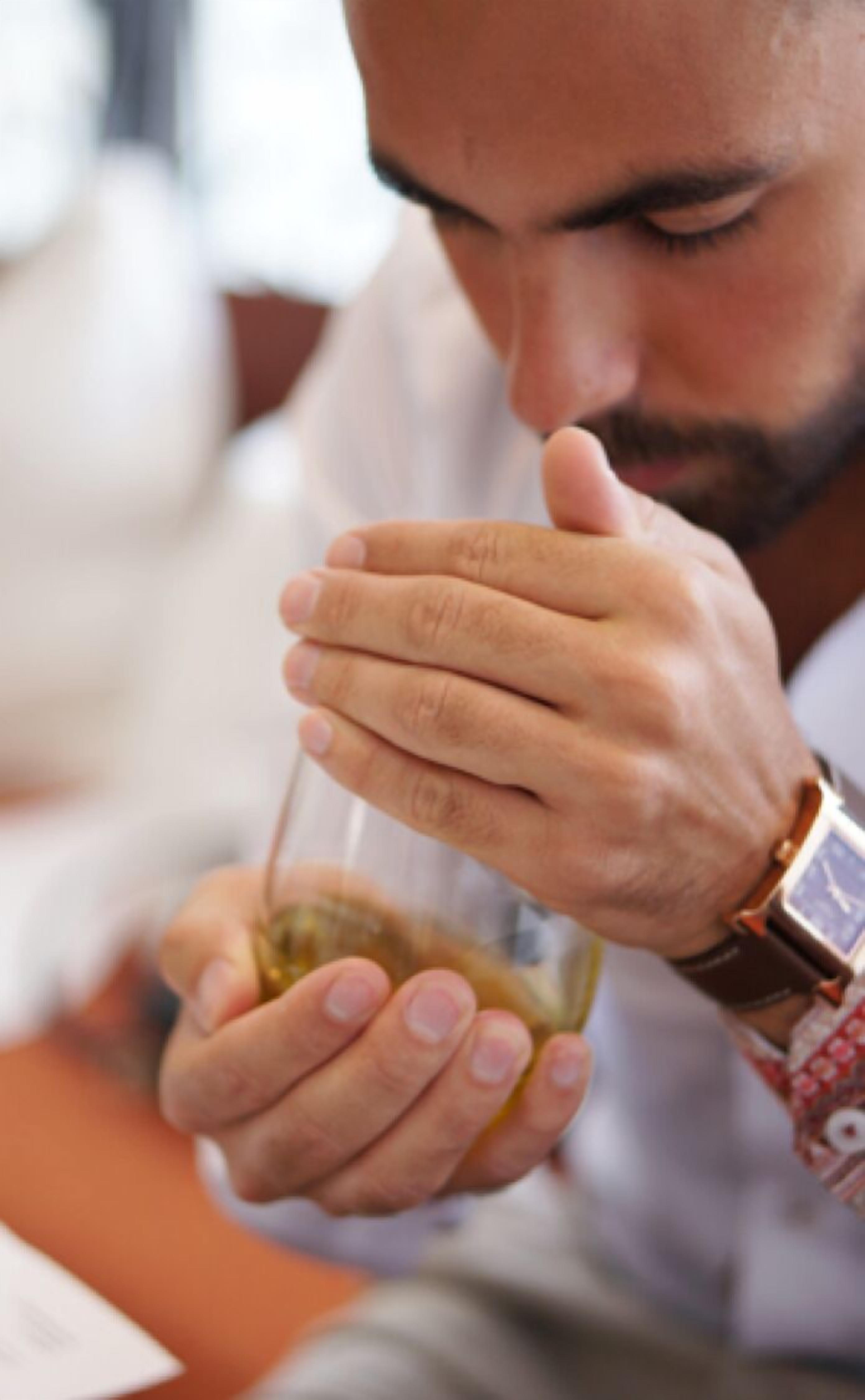 A person holding a glass of wine.