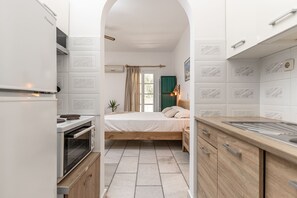 Apartment, 2 Bedrooms, Garden View, Ground Floor | Private kitchen | Fridge, stovetop, electric kettle, cookware/dishes/utensils