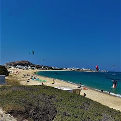 On the beach, white sand, free beach cabanas, beach umbrellas