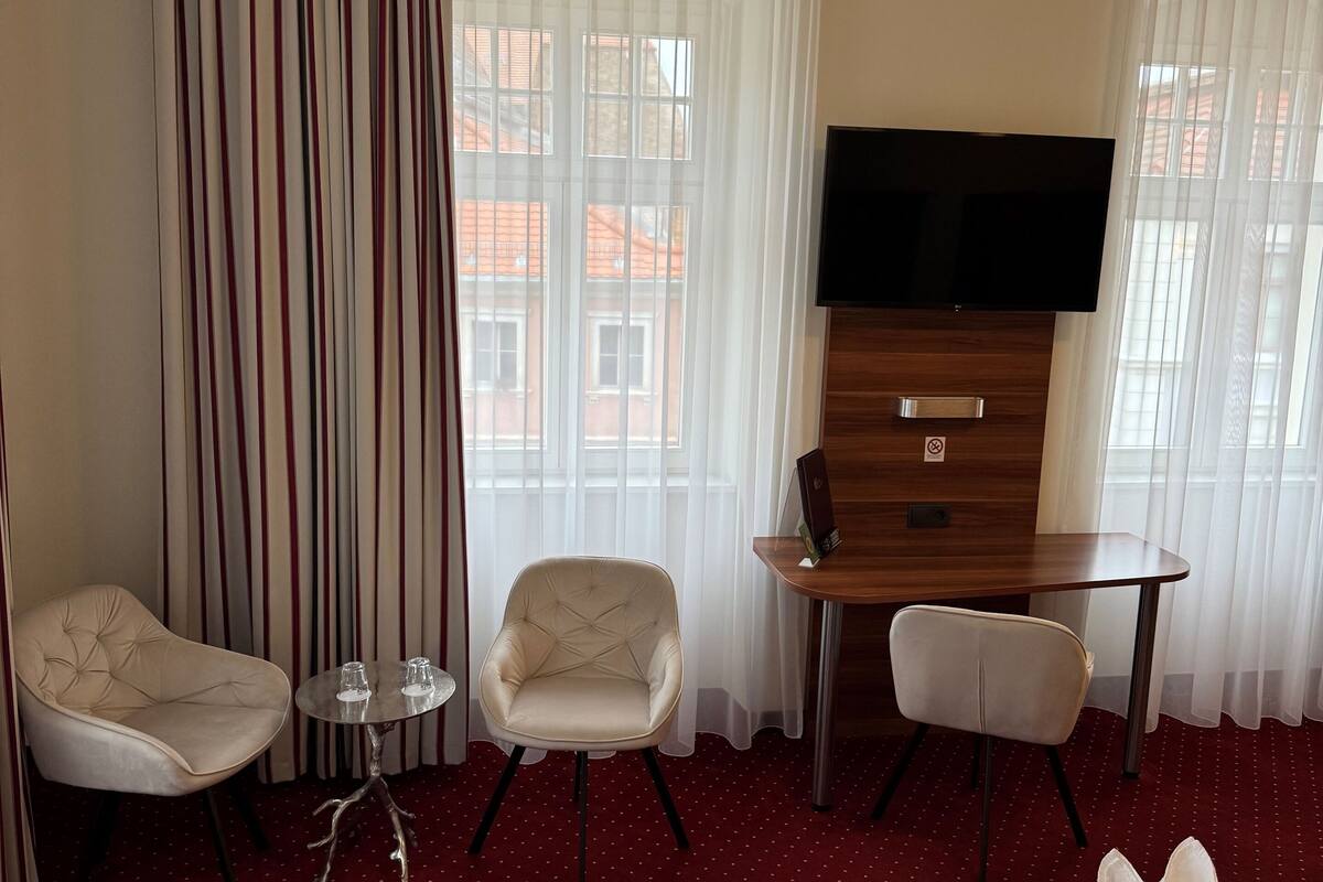 comfort quadruple room, 1 bedroom, city view | premium bedding, pillow-top beds, desk, laptop workspace