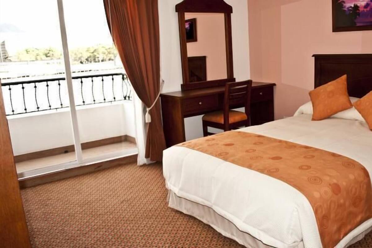 Hypo-allergenic bedding available, down comforters, in-room safe, desk
