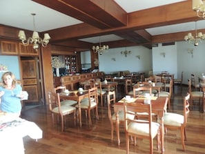 Dine in style with a variety of tables and chairs in this elegant space.
