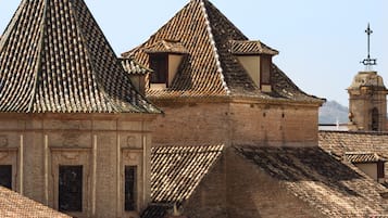 A historic building with a steeply pitched roof and traditional brickwork.