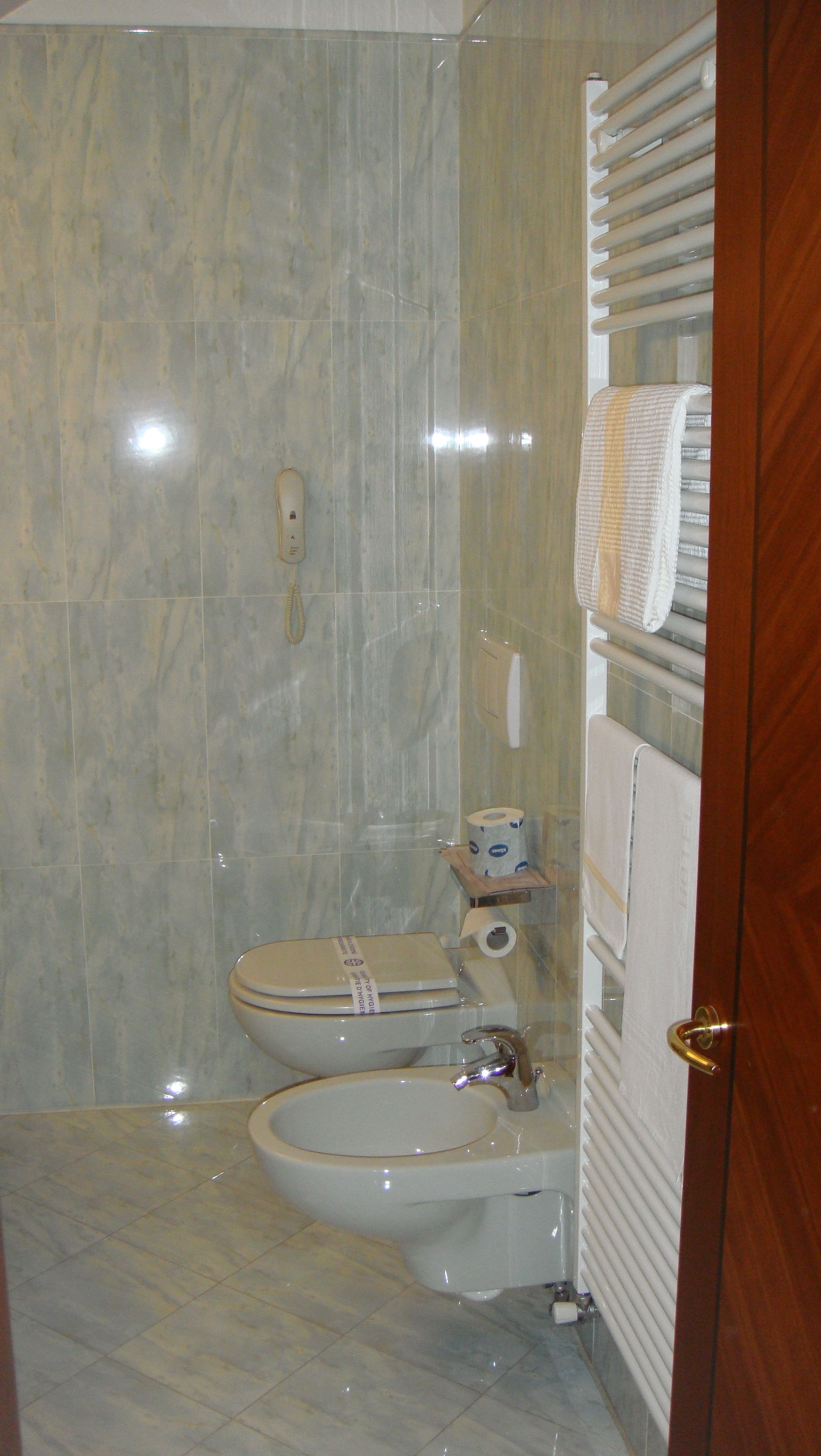 rainfall showerhead, designer toiletries, hair dryer, bathrobes