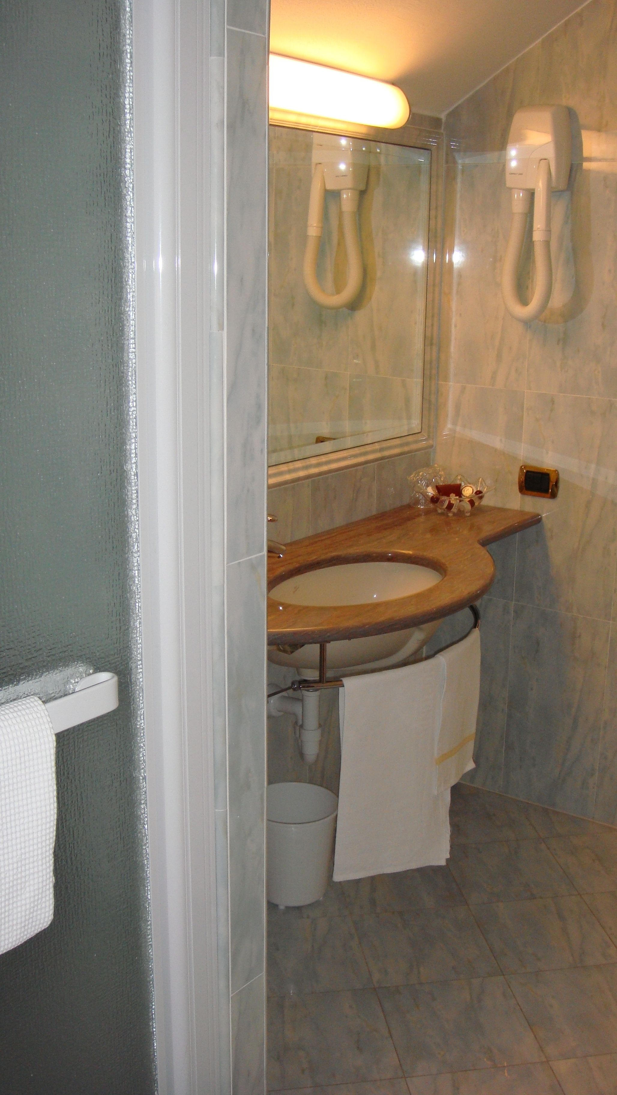 rainfall showerhead, designer toiletries, hair dryer, bathrobes