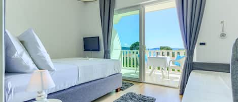 Deluxe Double or Twin Room, Terrace, Sea View | Minibar, in-room safe, desk, soundproofing