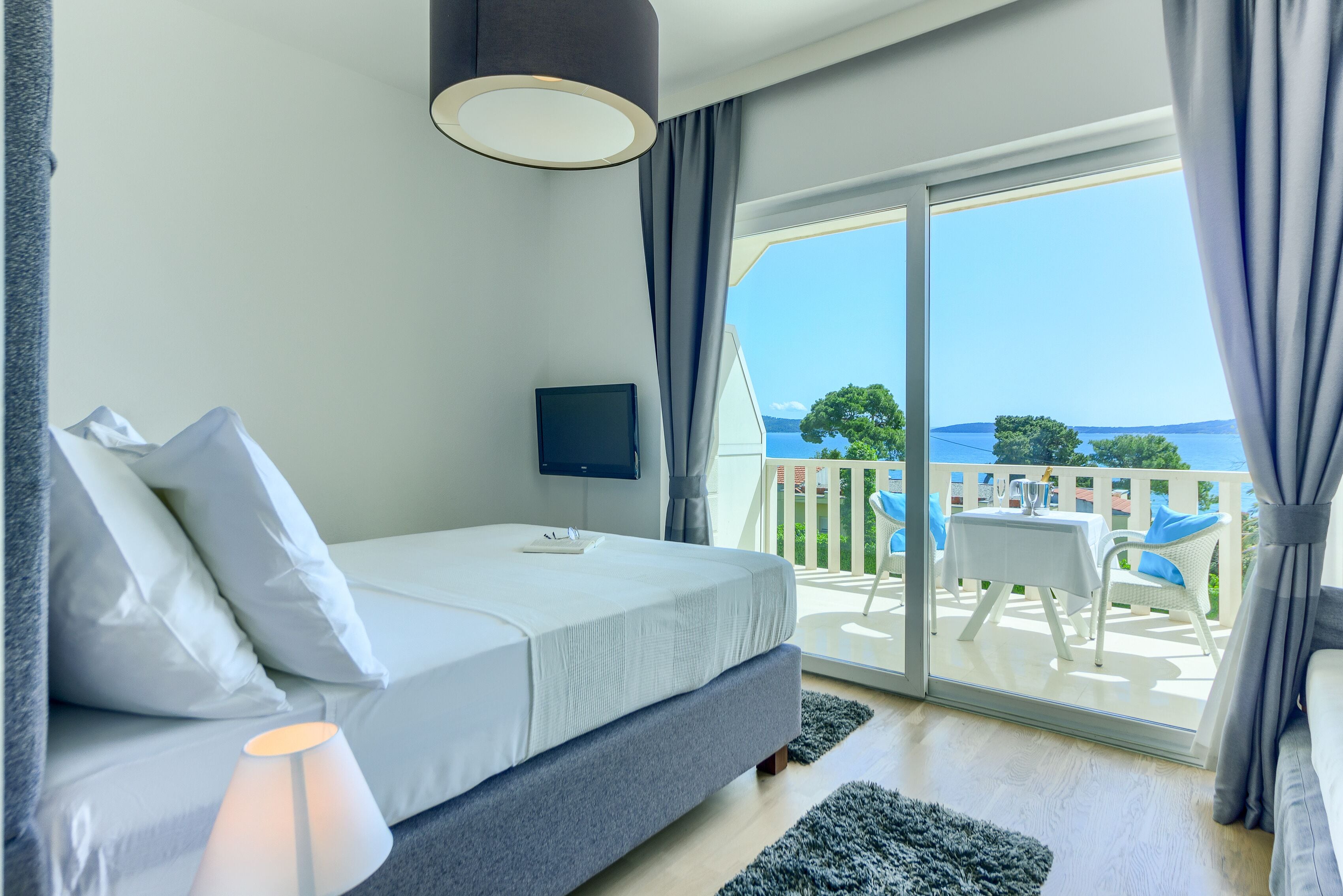 deluxe double or twin room, terrace, sea view | minibar, in-room safe, desk, blackout curtains