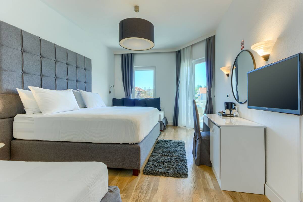 family room, terrace | minibar, in-room safe, desk, blackout curtains