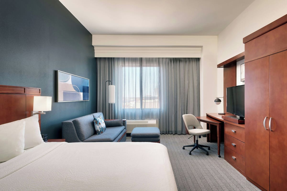 desk, laptop workspace, iron/ironing board, rollaway beds