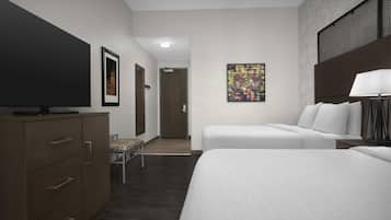 A hotel room with two beds, a TV, a desk, and a chair.