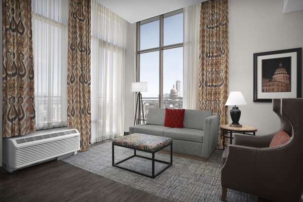 Suite, One King Bed, with Balcony | Living area | 32-inch TV with cable channels, pay movies