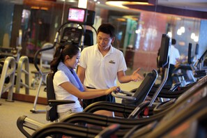 A gym with treadmills and exercise equipment.