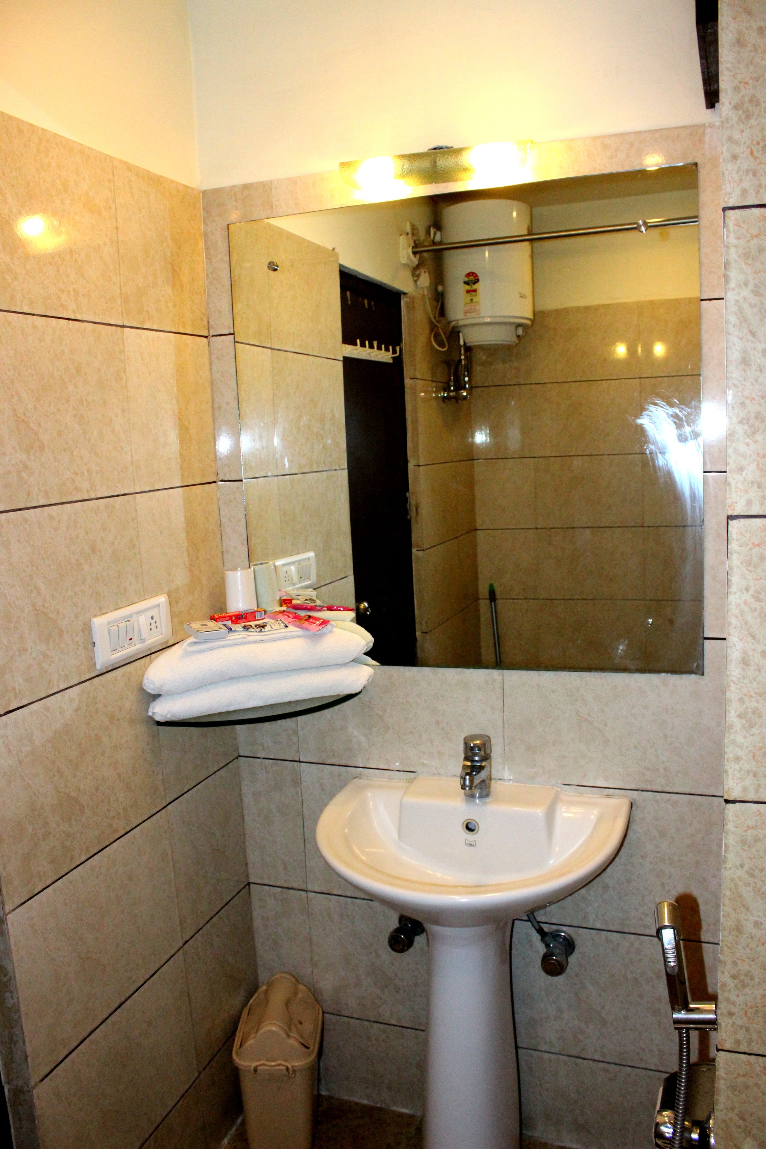 family room | bathroom | shower, rainfall showerhead, free toiletries, hair dryer
