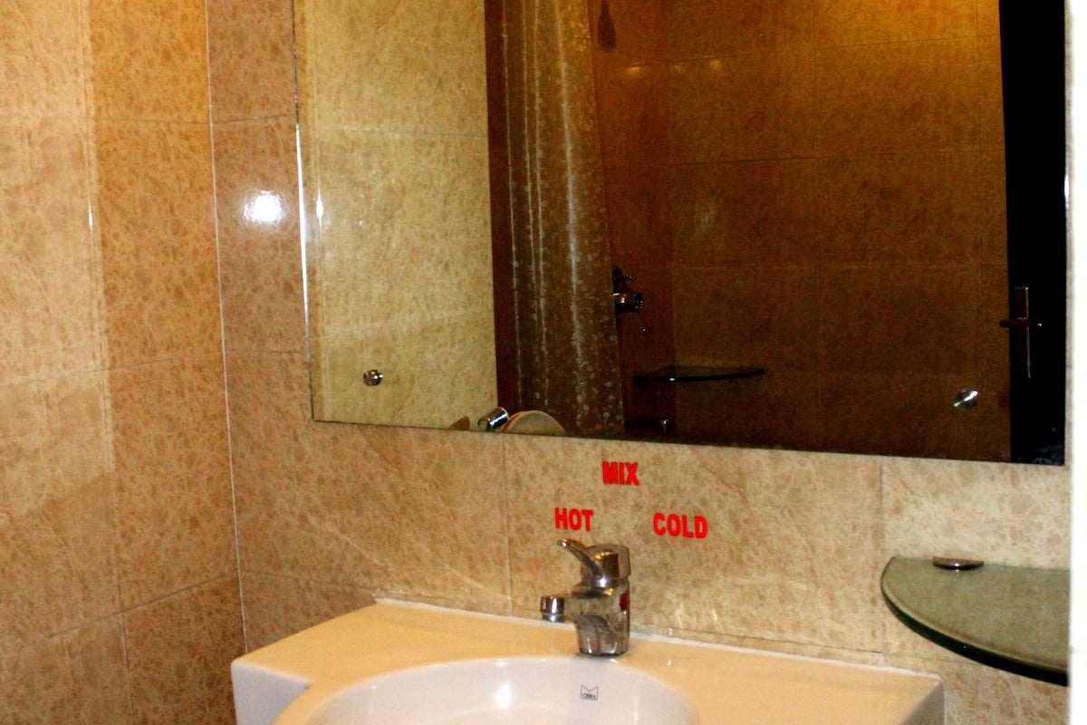 family room | bathroom | shower, rainfall showerhead, free toiletries, hair dryer
